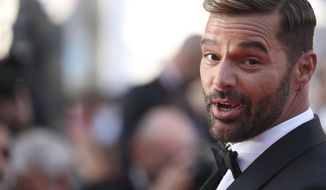 Ricky Martin poses for photographers upon arrival at the premiere of the film &#39;Elvis&#39; at the 75th international film festival, Cannes, southern France, May 25, 2022.  A judge has issued a restraining order against Martin, police said Saturday, July 2, 2022. (Photo by Vianney Le Caer/Invision/AP File)