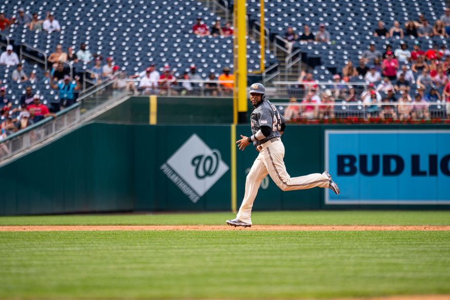 Washington Nationals designated hitter Nelson Cruz (23) advancing to third base against the Miami Marlins at Nationals Park in Washington, D.C., July 2, 2022 (Photo by All-Pro Reels / Liam Brennan).