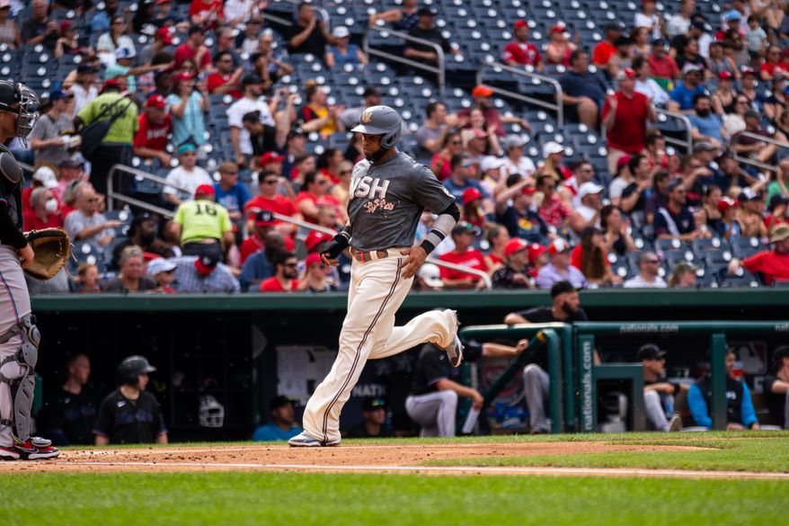 Washington Nationals designated hitter Nelson Cruz (23) scores against the Miami Marlins at Nationals Park in Washington, D.C., July 2, 2022 (Photo by All-Pro Reels / Liam Brennan).