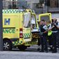 An ambulance and armed police outside the Field&#39;s shopping center, in Orestad, Copenhagen, Denmark, Sunday, July 3, 2022, after reports of shots fired. (Olafur Steinar Gestsson /Ritzau Scanpix via AP)