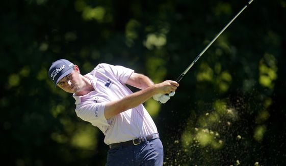 J.T. Poston hits off the sixth tee during the final round of the John Deere Classic golf tournament, Sunday, July 3, 2022, at TPC Deere Run in Silvis, Ill. (AP Photo/Charlie Neibergall)