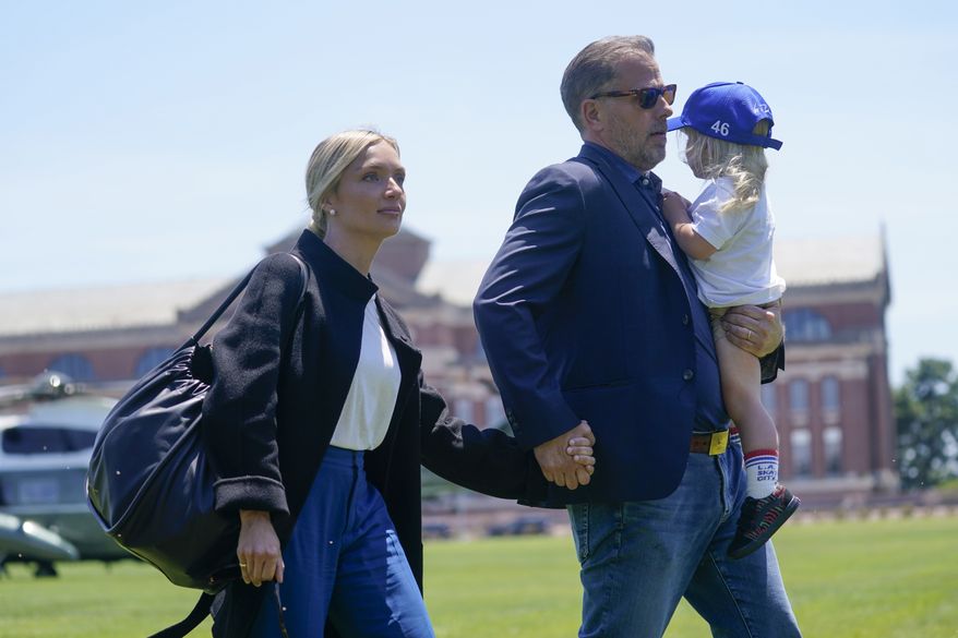 Melissa Cohen Biden walks with her husband Hunter Biden and their son Beau as they arrive with President Joe Biden at Fort McNair aboard Marine One after spending the weekend at Camp David, Monday, July 4, 2022, in Washington. (AP Photo/Evan Vucci)