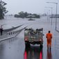 An emergency vehicle blocks access to the flooded Windsor Bridge on the outskirts of Sydney, Australia, Monday, July 4, 2022. More than 30,000 residents of Sydney and its surrounds have been told to evacuate or prepare to abandon their homes on Monday as Australia&#39;s largest city braces for what could be its worst flooding in 18 months. (AP Photo/Mark Baker)