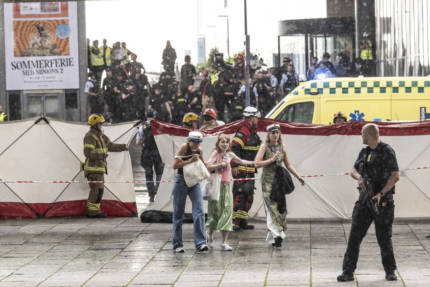 People leave the Field&#39;s shopping center in Copenhagen, Denmark Sunday, July 3, 2022. A gunman opened fire inside the busy shopping mall in the Danish capital Sunday, killing a few people and critically wounding a few others, police said. (Olafur Steinar Rye Gestsson/Ritzau Scanpix via AP)