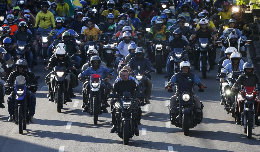 Brazil&#x27;s President Jair Bolsonaro, center, leads a motorcycle rally in Manaus, Brazil, June 18, 2022. With the election just three months off, some polls show only one in five women will vote for the tough-talking, pro-gun, motorcycle-riding former Army captain. (AP Photo/Edmar Barros, File)