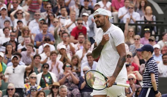 Australia&#39;s Nick Kyrgios reacts after winning a point against Brandon Nakashima of the US in a men&#39;s singles fourth round match on day eight of the Wimbledon tennis championships in London, Monday, July 4, 2022. (AP Photo/Alberto Pezzali)