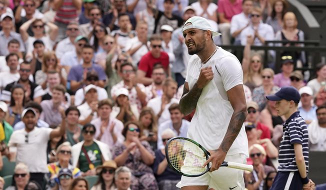 Australia&#x27;s Nick Kyrgios reacts after winning a point against Brandon Nakashima of the US in a men&#x27;s singles fourth round match on day eight of the Wimbledon tennis championships in London, Monday, July 4, 2022. (AP Photo/Alberto Pezzali)