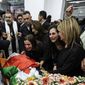 Colleagues and friends react as the Palestinian flag-draped body of veteran Al Jazeera journalist Shireen Abu Akleh is brought to the news channel&#x27;s office in the West Bank city of Ramallah, Wednesday, May 11, 2022. U.S. officials have concluded that gunfire from Israeli positions likely killed Abu Akleh but that there was “no reason to believe” her shooting was intentional, the State Department said Monday, July 4, 2022. (Abbas Momani/Pool via AP) **FILE**