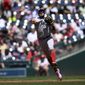 Miami Marlins shortstop Miguel Rojas throws to first to put out Washington Nationals&#39; Lane Thomas during the third inning of a baseball game, Monday, July 4, 2022, in Washington. (AP Photo/Nick Wass)