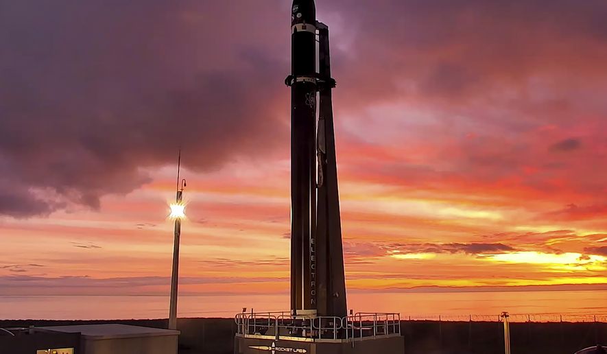 Rocket Lab&#39;s Electron rocket waits on the launch pad on the Mahia peninsula in New Zealand, Tuesday, June 28, 2022. NASA wants to experiment with a new orbit around the moon which it hopes to use in the coming years to once again land astronauts on the lunar surface. (Rocket Lab via AP)