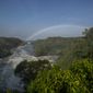 A rainbow forms in the mist at the top of the waterfalls in Murchison Falls National Park, northwest Uganda, on Feb. 22, 2020. The East Africa Crude Oil Pipeline, a controversial oil project that would connect oilfields in the park to a port in Tanzania is in breach of global environmental and human rights guidelines for banks, according to a new report by Inclusive Development International on Tuesday, July 5. (AP Photo)