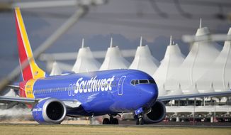 Southwest Airlines jetliner taxis down a runway to take off from Denver International Airport Tuesday, July 5, 2022, in Denver. (AP Photo/David Zalubowski)