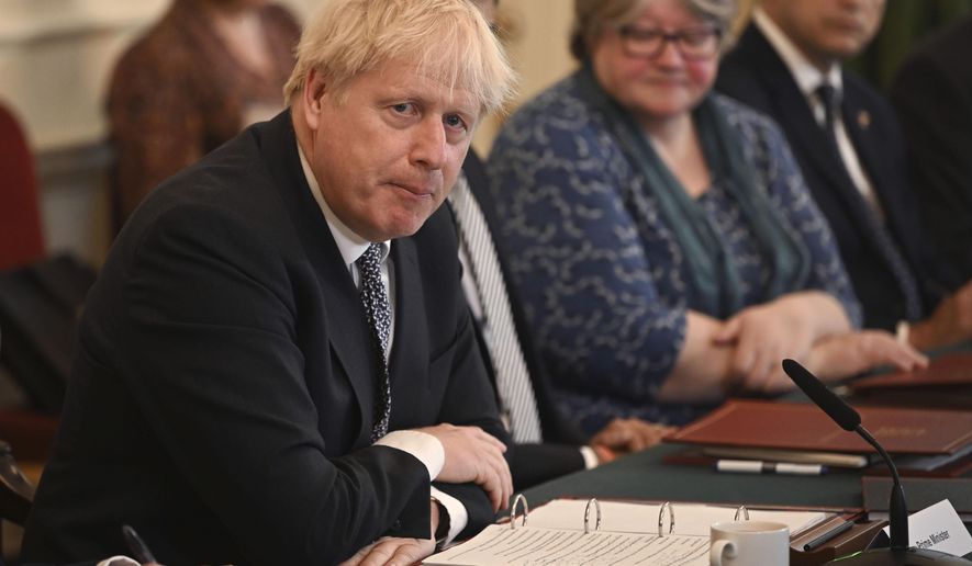 Britain&#39;s Prime Minister Boris Johnson speaks at the start of a cabinet meeting, in Downing Street, London, Tuesday, July 5, 2022. (Justin Tallis/Pool Photo via AP)