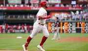Philadelphia Phillies&#39; Kyle Schwarber, left, rounds the bases after hitting a home run against Washington Nationals pitcher Paolo Espino during the first inning of a baseball game, Tuesday, July 5, 2022, in Philadelphia. (AP Photo/Matt Slocum)