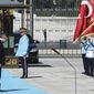 Italy&#39;s Prime Minister Mario Draghi, second left, and Turkey&#39;s President Recep Tayyip Erdogan review an honour guard prior their meeting at the Turkish Presidential palace in Ankara, Turkey, Tuesday, July 5, 2022. Draghi is on an official visit to Turkey. (AP Photo)