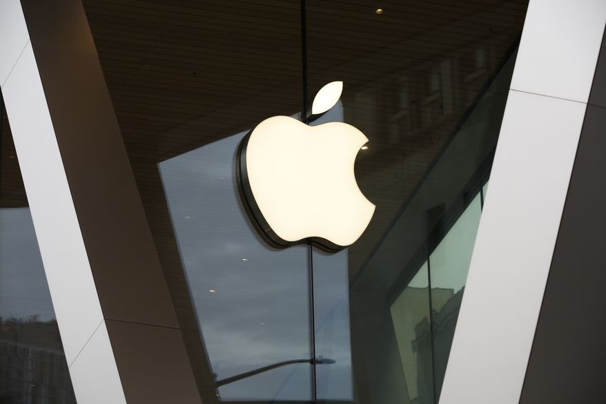 In this Saturday, March 14, 2020, photo, an Apple logo adorns the facade of the downtown Brooklyn Apple store in New York. (AP Photo/Kathy Willens) **FILE**