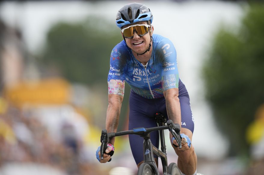 Stage winner Australia&#39;s Simon Clarke reacts after crossing the finish line of the fifth stage of the Tour de France cycling race over 157 kilometers (97.6 miles) with start in Lille Metropole and finish in Arenberg Porte du Hainaut, France, Wednesday, July 6, 2022. (AP Photo/Daniel Cole)