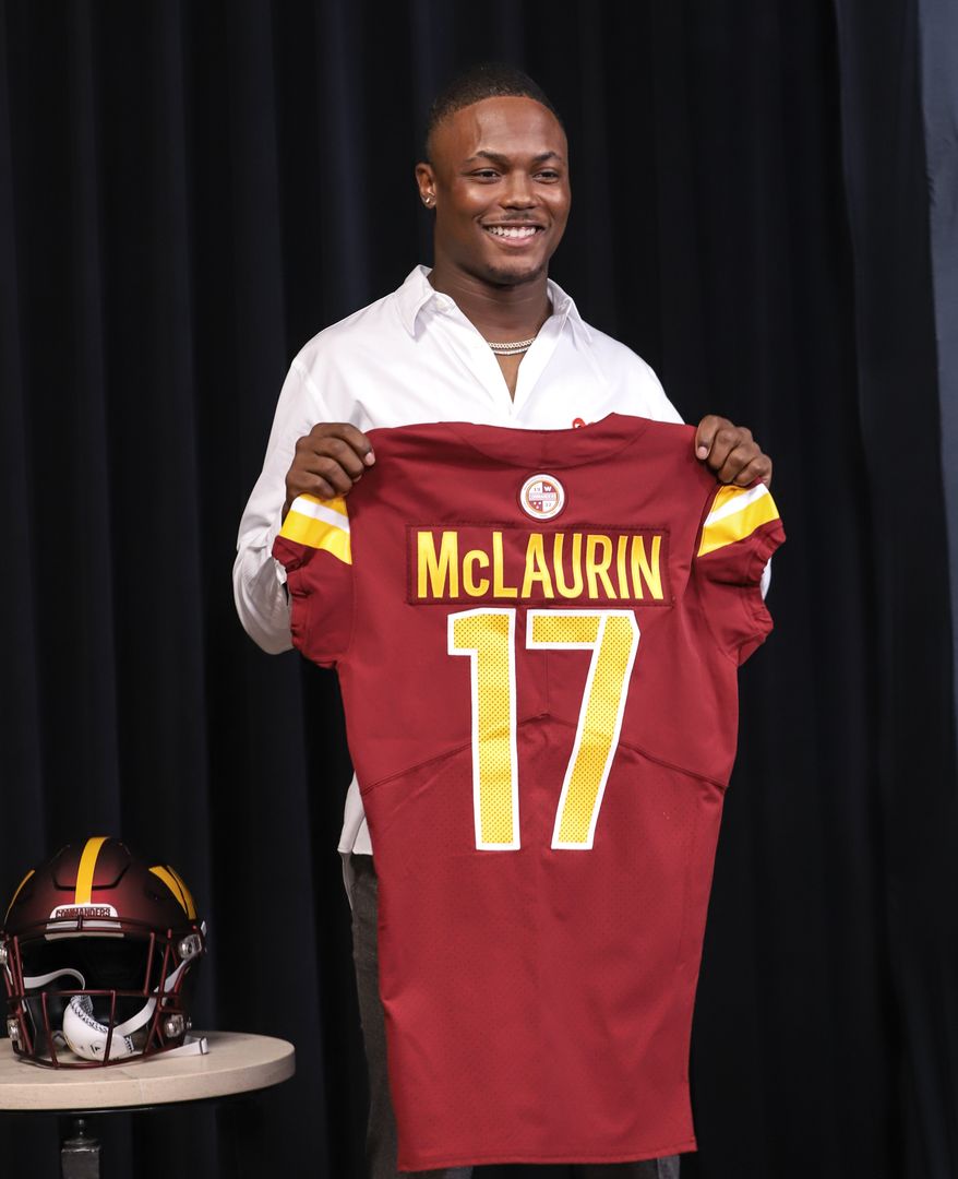 Wide Receiver Terry McLaurin holding up his jersey after the contact extension press conference at the Inova Sports and Performance Center in Ashburn, VA on July 6th 2022. (Photo: Alyssa Howell)