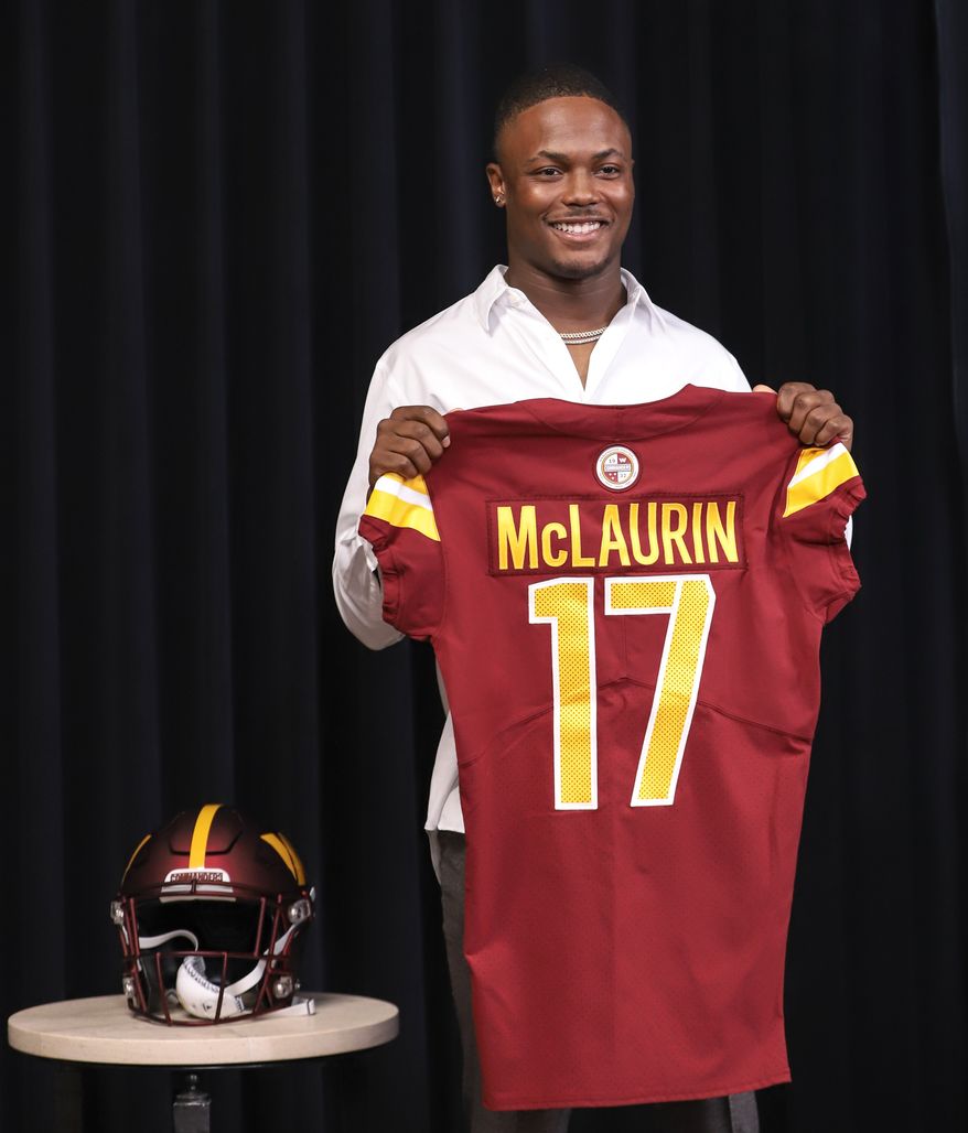 Wide Receiver Terry McLaurin holding up his jersey after the contact extension press conference at the Inova Sports and Performance Center in Ashburn, VA on July 6th 2022. (Photo: Alyssa Howell)
