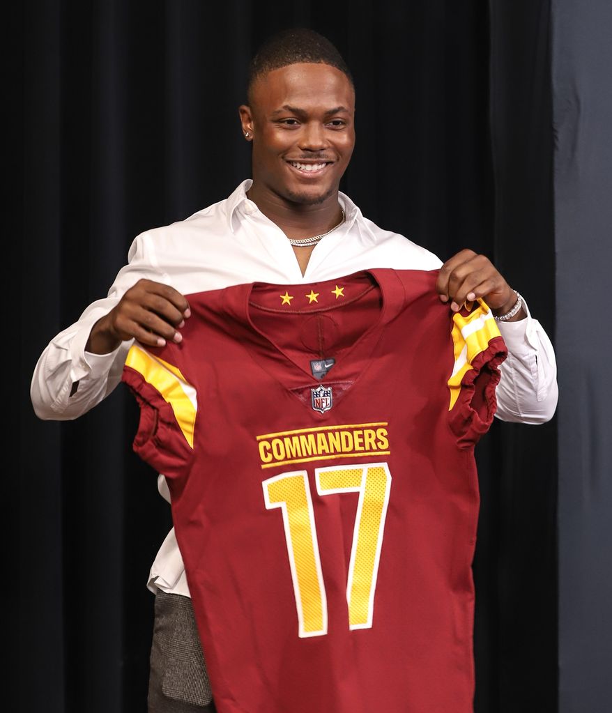 Wide Receiver Terry McLaurin holding up his jersey after the contact extension press conference at the Inova Sports and Performance Center in Ashburn, VA on July 6th 2022. (Photo: Alyssa Howell)