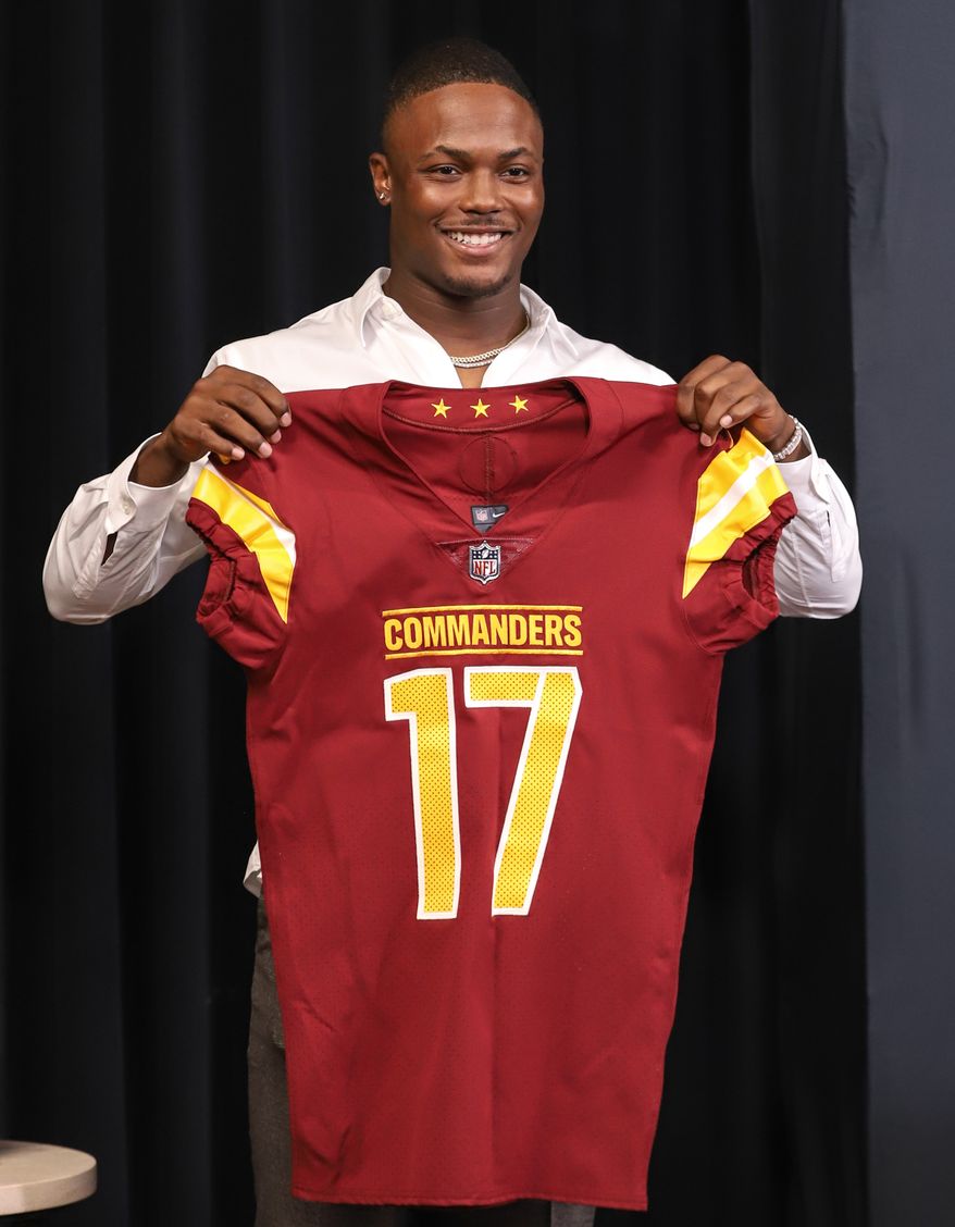 Wide Receiver Terry McLaurin holding up his jersey after the contact extension press conference at the Inova Sports and Performance Center in Ashburn, VA on July 6th 2022. (Photo: Alyssa Howell)