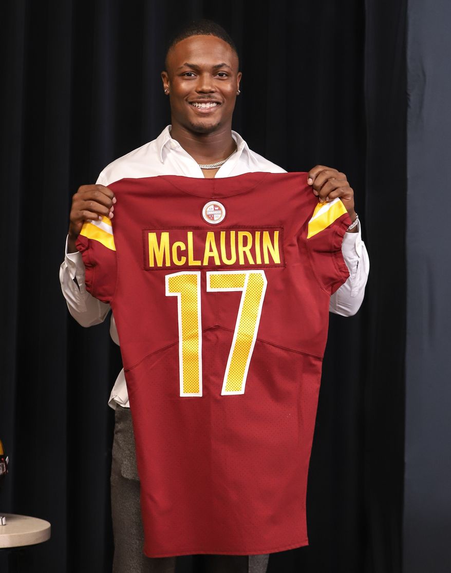 Wide Receiver Terry McLaurin holding up his jersey after the contact extension press conference at the Inova Sports and Performance Center in Ashburn, VA on July 6th 2022. (Photo: Alyssa Howell)