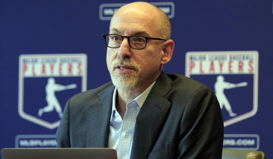IFILE - Major League Baseball Players Association Senior Director, Collective Bargaining &amp;amp; Legal,, Bruce Meyer answers a question at a press conference in their offices in New York, on March 11, 2022. Meyer was promoted to deputy executive director of the Major League Baseball Players Association on Wednesday, July 6, 2022, after leading the union’s negotiations during a 99-day lockout that ended in March. (AP Photo/Richard Drew, File)
