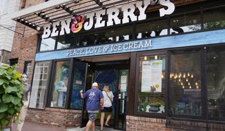 Two patrons enter the Ben &amp;amp; Jerry&#39;s Ice Cream shop, July 20, 2021, in Burlington, Vt. The Vermont-based ice cream maker is suing its corporate parent Unilever over a plan that would allow its product to be sold in east Jerusalem and the occupied West Bank. In a lawsuit filed Tuesday, July 6, 2022 in New York, the ice cream maker asked a court to block the decision by Unilever to sell the business interest in the ice cream company in Israel to a local company that would sell ice cream with Hebrew and Arabic labeling poses “poses a risk” to the integrity of the Ben &amp;amp; Jerry’s brand name. (AP Photo/Charles Krupa)