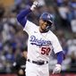 Los Angeles Dodgers&#39; Mookie Betts celebrates as he rounds third after hitting a solo home run during the third inning of a baseball game against the Colorado Rockies Tuesday, July 5, 2022, in Los Angeles. (AP Photo/Mark J. Terrill)