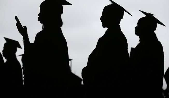 In this May 17, 2018, file photo, new graduates line up before the start of the Bergen Community College commencement at MetLife Stadium in East Rutherford, N.J. (AP Photo/Seth Wenig, File)
