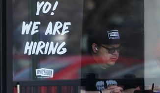 A hiring sign is displayed at a restaurant in Schaumburg, Ill., Friday, April 1, 2022. (AP Photo/Nam Y. Huh) **FILE**
