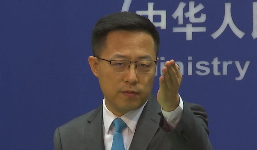 Chinese Foreign Ministry spokesperson Zhao Lijian gestures during a press conference at the Ministry of Foreign Affairs in Beijing on July 6, 2022. The United States is “the biggest threat to world peace, stability and development,&amp;quot; China said Thursday,  July 7, continuing its sharp rhetoric in response to U.S. accusations of Chinese spying and threats to the international order. (AP Photo/Liu Zheng, File)