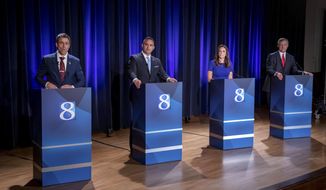 Michigan Republican candidates for governor Ryan Kelley, of Allendale, from left, Garrett Soldano, of Mattawan, Tudor Dixon, of Norton Shores and Kevin Rinke, of Bloomfield Township, appear at a debate in Grand Rapids, Mich., July 6, 2022. (Michael Buck/WOOD TV8 via AP, File)
