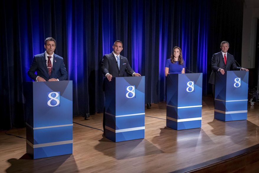 Michigan Republican candidates for governor Ryan Kelley, of Allendale, from left, Garrett Soldano, of Mattawan, Tudor Dixon, of Norton Shores and Kevin Rinke, of Bloomfield Township, appear at a debate in Grand Rapids, Mich., July 6, 2022. (Michael Buck/WOOD TV8 via AP, File)