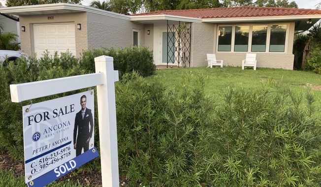 FILE - A home with a &amp;quot;Sold&amp;quot; sign is shown, Sunday, May 2, 2021, in Surfside, Fla.  Average long-term U.S. mortgage rates inched up this week following last week’s mammoth jump, the biggest in 35 years. Mortgage buyer Freddie Mac reported Thursday, June 23, 2022,  that the 30-year rate ticked up to 5.81% this week, from last week’s 5.78%.  (AP Photo/Wilfredo Lee, File)