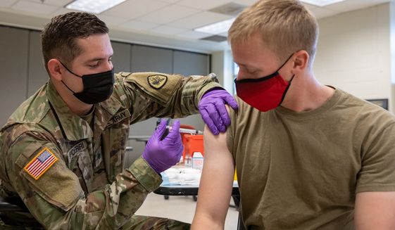 Army Spc. Tristan Spoerri, with the Utah National Guard Medical Detachment, administers the first dose of the COVID-19 vaccine to a soldier on Camp Williams, Utah, Sept. 11, 2021. The Department of Defense ordered mandatory vaccinations to protect the Force and ensure their readiness to defend the American people. (U.S. Army National Guard photo by Spc. Alejandro Lucero)