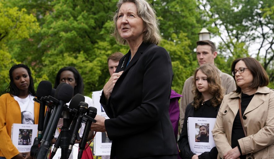 Elizabeth Whelan, sister of U.S. Marine Corps veteran and Russian prisoner Paul Whelan, speaks at a news conference alongside families of Americans currently being held hostage or wrongfully detained overseas in Lafayette Park near the White House, May 4, 2022, in Washington. President Joe Biden spoke by phone July 8 with Elizabeth Whelan according to the White House. Biden&#39;s phone call came after Biden and Vice President Kamala Harris spoke earlier this week to the wife of WNBA star Brittney Griner, who has been held for more than four months in Russia. (AP Photo/Patrick Semansky, File)