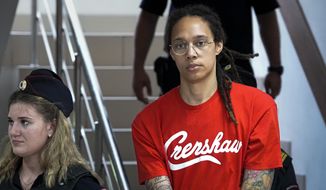WNBA star and two-time Olympic gold medalist Brittney Griner is escorted to a courtroom for a hearing, in Khimki just outside Moscow, Russia, Thursday, July 7, 2022. Griner pleaded guilty Thursday to drug possession charges on the second day of her trial in a Russian court in a case that could see her sentenced to up to 10 years in prison. (AP Photo/Alexander Zemlianichenko) **FILE**