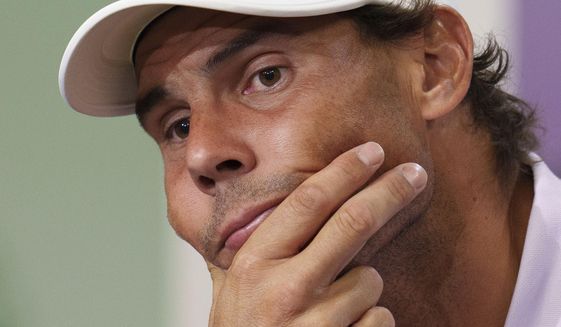 Spain&#39;s Rafael Nadal announces that he is withdrawing from the semi-final of the Gentlemen&#39;s Singles during a press conference at The All England Lawn Tennis Club, Wimbledon, Thursday, July 7, 2022. Rafael Nadal withdrew from Wimbledon on Thursday because of a torn abdominal muscle, announcing his decision a day before he was supposed to play in the semifinals. (Joe Toth/Pool Photo via AP)
