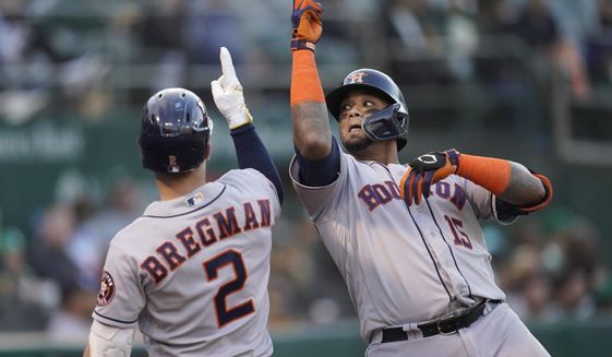 Houston Astros&#39; Martin Maldonado, right, is congratulated by Alex Bregman after hitting a three-run home run against the Oakland Athletics during the fifth inning of a baseball game in Oakland, Calif., Friday, July 8, 2022. (AP Photo/Jeff Chiu)