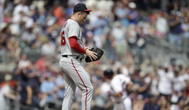 Washington Nationals&#x27; Patrick Corbin, foreground, waits for Atlanta Braves&#x27; Austin Riley, back right, to run the bases after Riley hit a two-run home run in the first inning of a baseball game Saturday, July 9, 2022, in Atlanta. (AP Photo/Ben Margot)