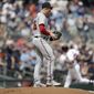 Washington Nationals&#x27; Patrick Corbin, foreground, waits for Atlanta Braves&#x27; Austin Riley, back right, to run the bases after Riley hit a two-run home run in the first inning of a baseball game Saturday, July 9, 2022, in Atlanta. (AP Photo/Ben Margot)