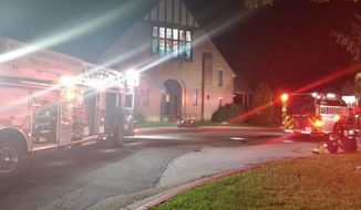 Fire trucks outside of Saint Jane Frances de Chantal Catholic Church in Bethesda early Sunday morning. A vandalism/arson attack at the congregation is believed to have caused $50,000 in damage. (CREDIT: Montgomery Country Fire &amp; Rescue Service via Twitter)