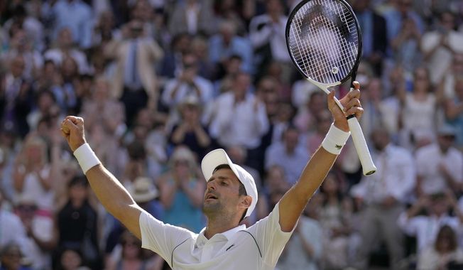 Serbia&#x27;s Novak Djokovic celebrates after beating Australia&#x27;s Nick Kyrgios to win the final of the men&#x27;s singles on day fourteen of the Wimbledon tennis championships in London, Sunday, July 10, 2022. (AP Photo/Alastair Grant)