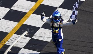 NASCAR Cup Series driver Chase Elliott (9) celebrates his victory after a NASCAR Cup Series race at Atlanta Motor Speedway in Hampton, Ga., on Sunday, July 10, 2022. (AP Photo/Bob Andres)