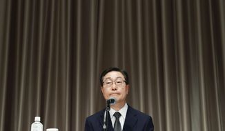 Tomihiro Tanaka, Japan branch head of South Korea’s Unification Church, speaks during a press conference in Tokyo, Monday, July 11, 2022. The Japan branch of South Korea’s Unification Church acknowledged Monday as its member the mother of the suspect in the assassination of former Prime Minister Shinzo Abe, but denied that it demanded large donations from anyone.(Yohei Fukai/Kyodo News via AP)