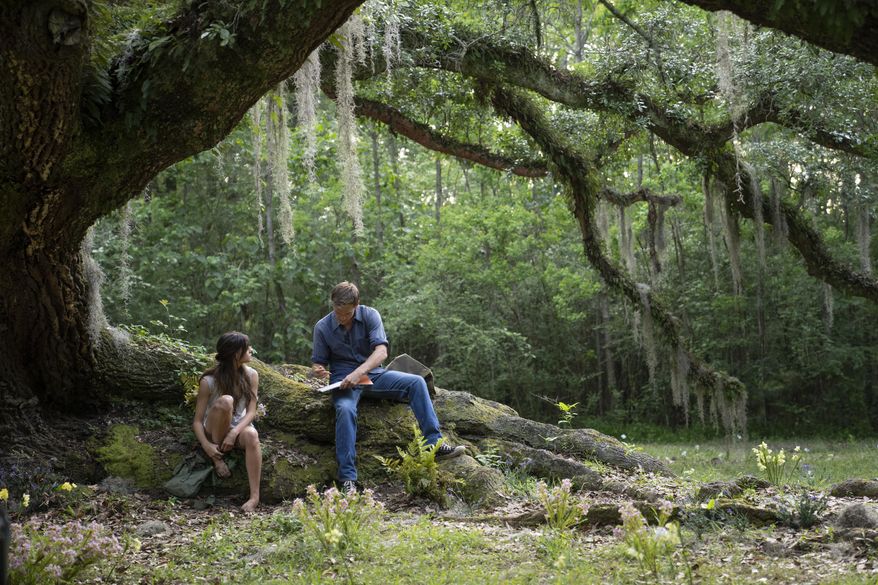This image released by Columbia Pictures shows Daisy Edgar-Jones, left, and Taylor John Smith in a scene from &amp;quot;Where the Crawdads Sing.&amp;quot;  (Michele K. Short/Sony Pictures via AP)