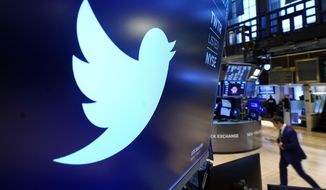 The logo for Twitter appears above a trading post on the floor of the New York Stock Exchange, Nov. 29, 2021.  Twitter&#39;s stock slid more than 6% before the market open Monday, July 11, 2022, after billionaire Elon Musk announced late Friday that he will abandon his $44 billion offer to buy Twitter and the company said it will sue the Tesla CEO to uphold the deal. (AP Photo/Richard Drew, File)