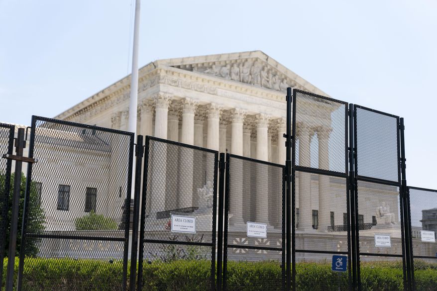 Police barriers are visible in front of the Supreme Court in Washington, July 1, 2022. The Marshal of the U.S. Supreme Court has asked Maryland officials to step up the enforcement of laws she says prohibit picketing outside the homes of the justices who live in the state. (AP Photo/Andrew Harnik, File)