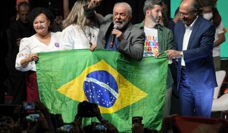 Brazil&#39;s former president who is running for reelection, Luiz Inacio Lula da Silva, center, speaks during a campaign rally in Brasilia, Brazil, Tuesday, July 12, 2022. (AP Photo/Eraldo Peres)